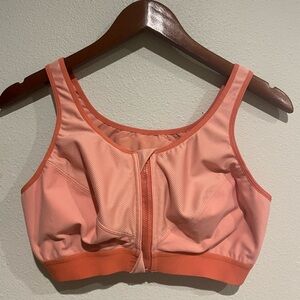 Syrokan front zip sports bra in dual orange tones. 38 DD